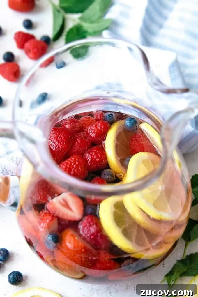 Berry Rosé Sangria Recipe for Summer Parties 6 up close photo of berry rosé sangria pitcher