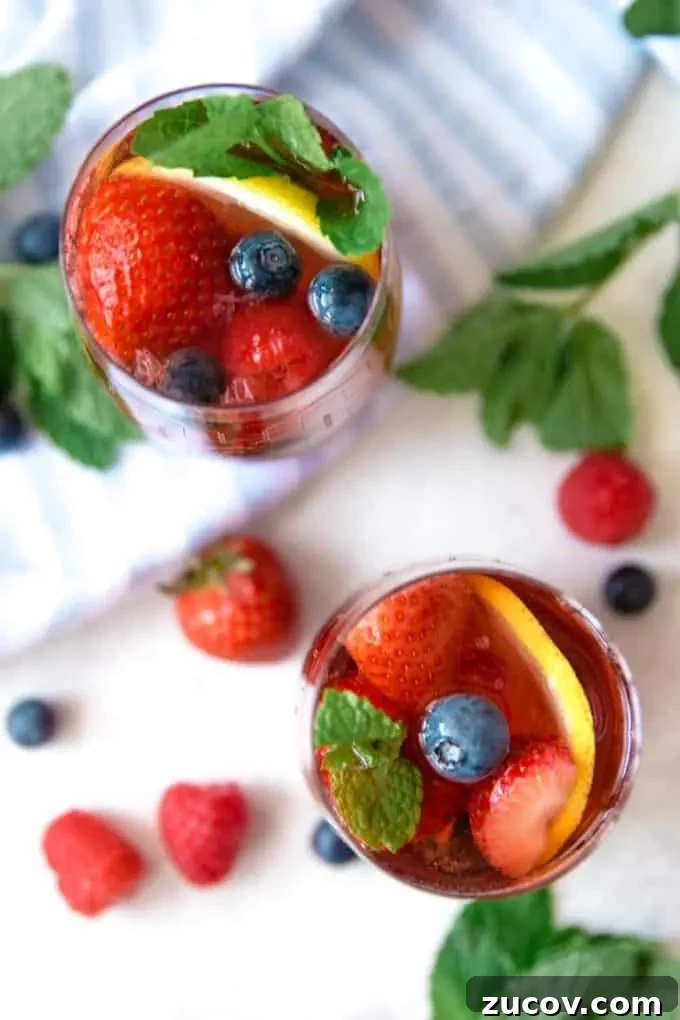 Berry Rosé Sangria Recipe for Summer Parties 8 two glasses of berry rosé sangria from above