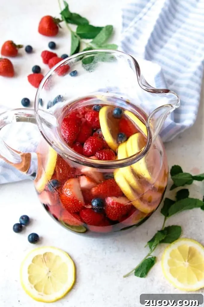 Berry Rosé Sangria Recipe for Summer Parties 5 photo of pitcher full of berry rosé sangria