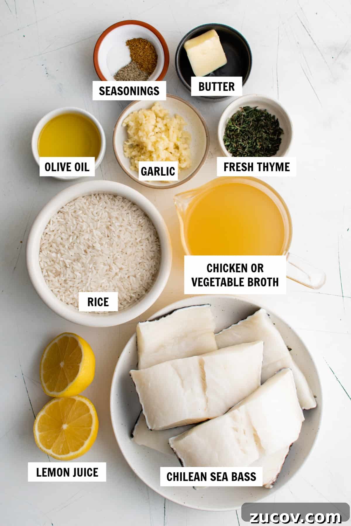 Pan-Seared Chilean Sea Bass with Garlic Herb Rice Recipe 3 all of the ingredients for chilean seas bass on a white countertop