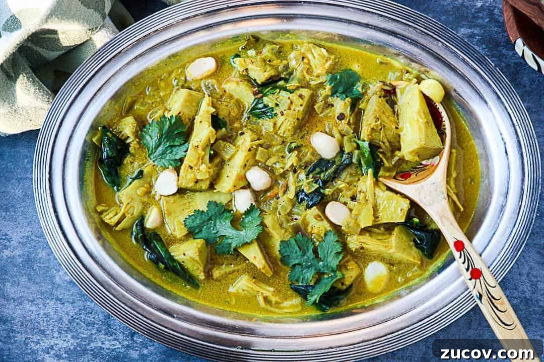 A bowl of food on a plate, with Jackfruit