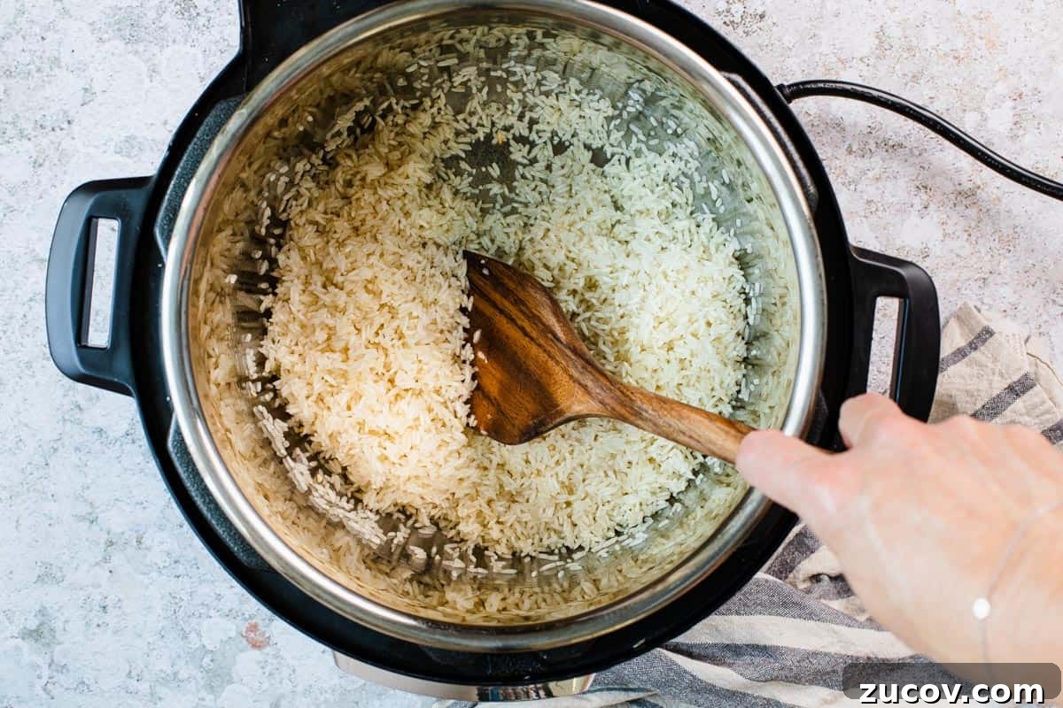 Instant Pot Arroz Rojo (Mexican Red Rice) 6 cooking rice in oil in an instant pot