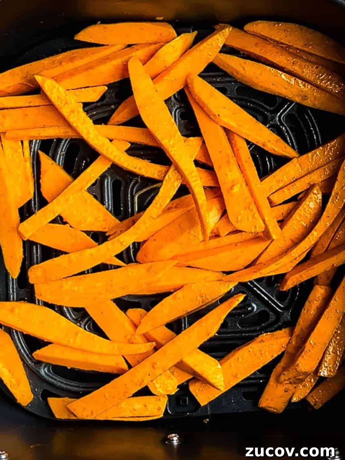 Crispy Air-Fryer Sweet Potato Fries Coated in Cornstarch 11 The fries added to the air fryer basket in a single layer.
