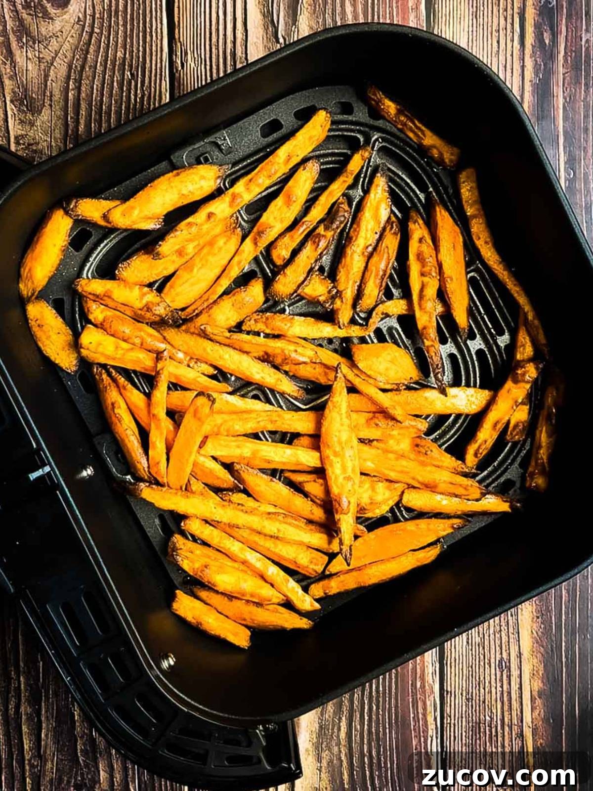 Crispy Air-Fryer Sweet Potato Fries Coated in Cornstarch 12 The crispy homemade fries in the air fryer basket.