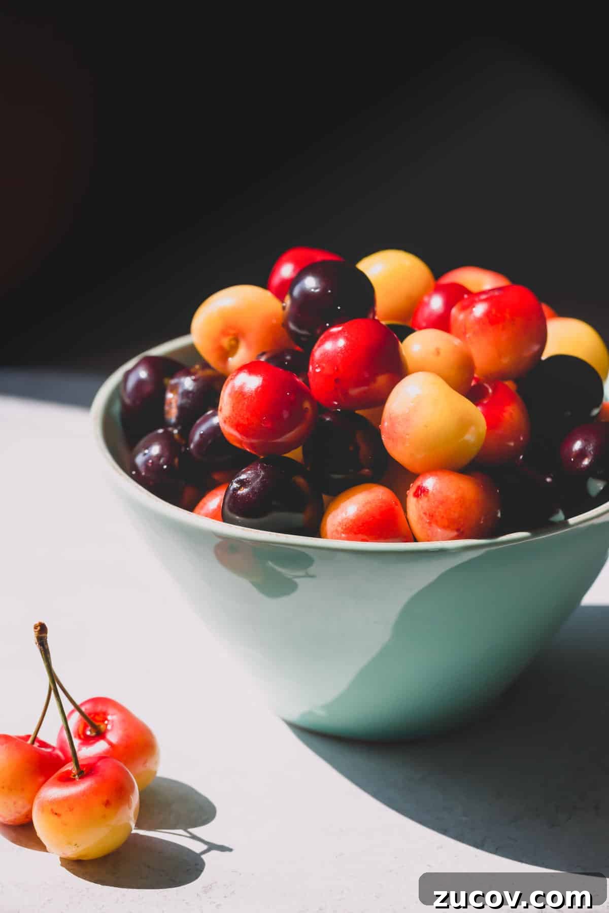 Cherry Guide: Varieties, Growing Tips, and Harvesting Advice 3 A bowl of rainier and sweet dark cherries.