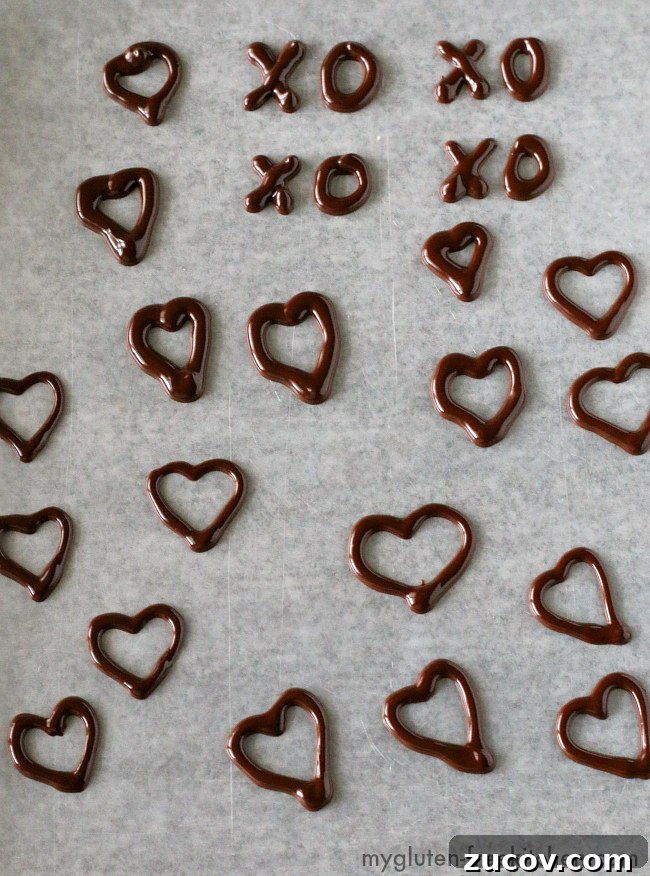 Dairy-Free Gluten-Free Chocolate Raspberry Mousse Pie Recipe 5 Practicing making Chocolate Heart Decorations. Using melted chocolate with a bit of shortening to make chocolate decorations.