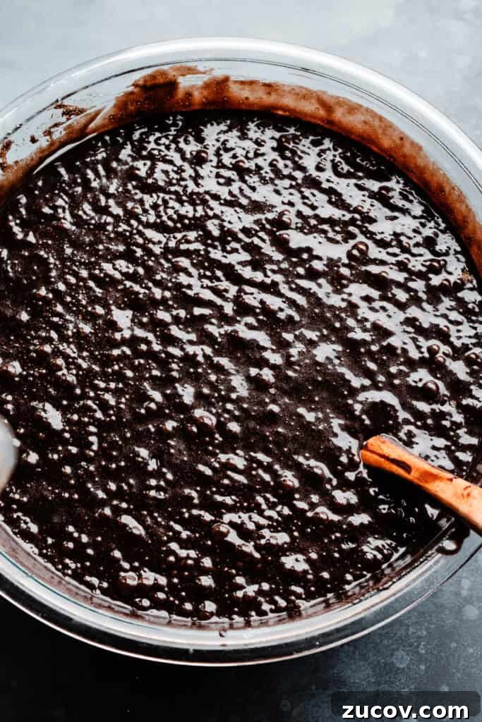Decadent Peanut Butter Chocolate Cake Recipe You’ll Love 5 A bowl of chocolate cake batter.