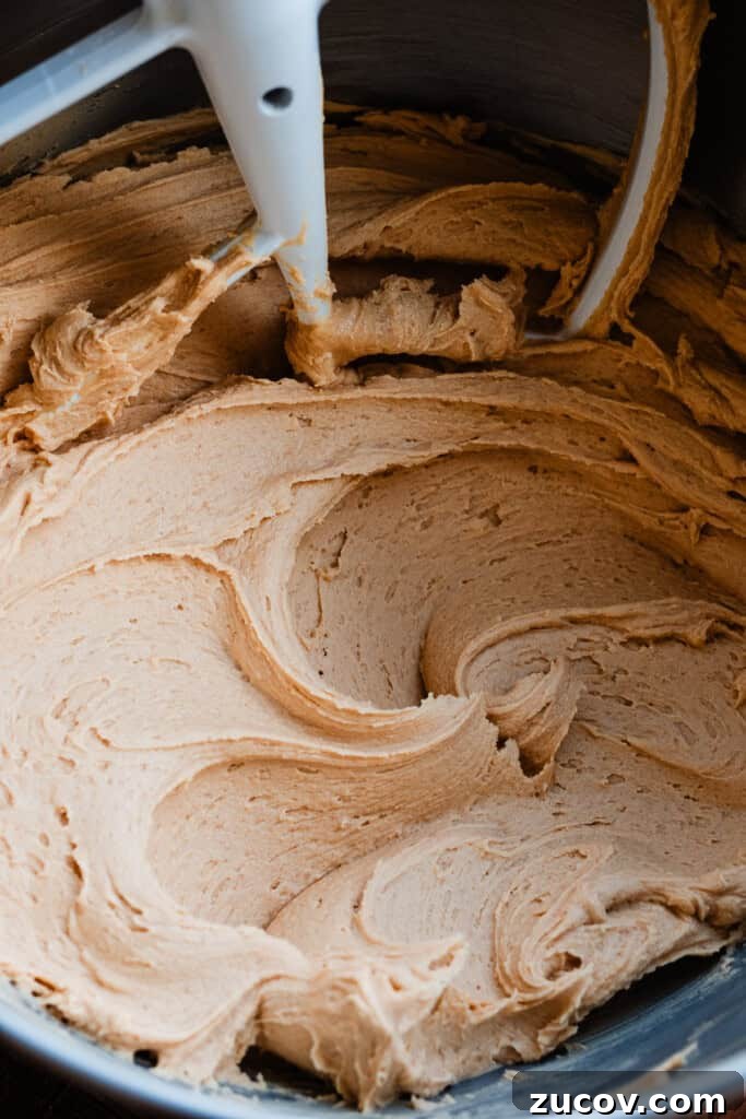 Decadent Peanut Butter Chocolate Cake Recipe You’ll Love 7 A bowl of creamy peanut butter frosting.