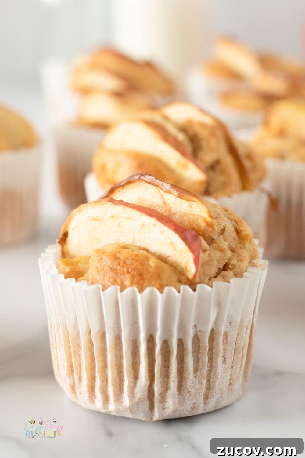 Warm Apple Cinnamon Muffins with Crumble Topping 3 Front image of a muffin made with a homemade apple muffins recipe
