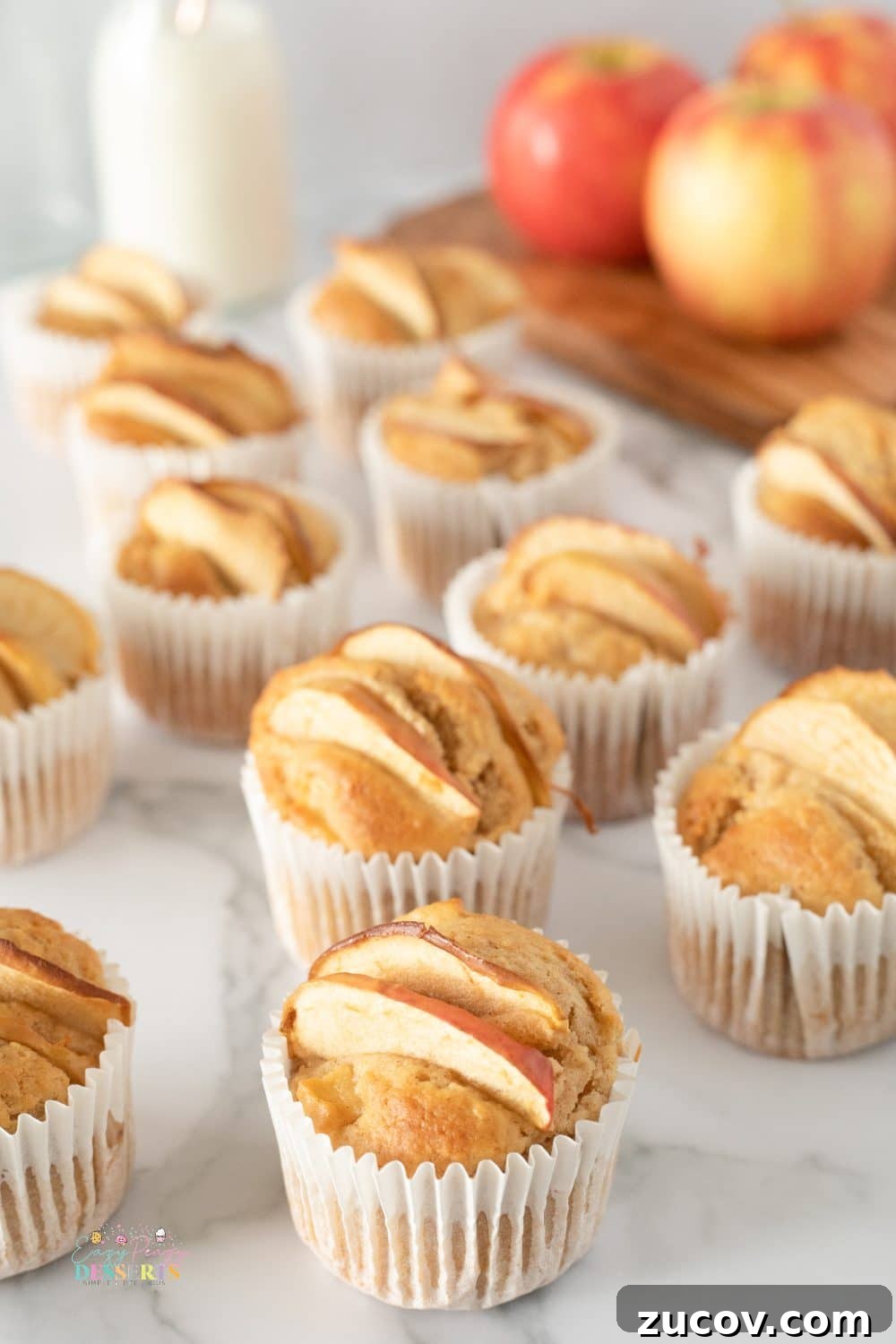 Warm Apple Cinnamon Muffins with Crumble Topping 4 Angle image of apple and cinnamon muffins in cupcake liners