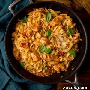 Creamy Marry Me Chicken Pasta Recipe for Weeknight Dinners 12 A square, overhead shot of Marry Me Chicken Pasta in a black pan.