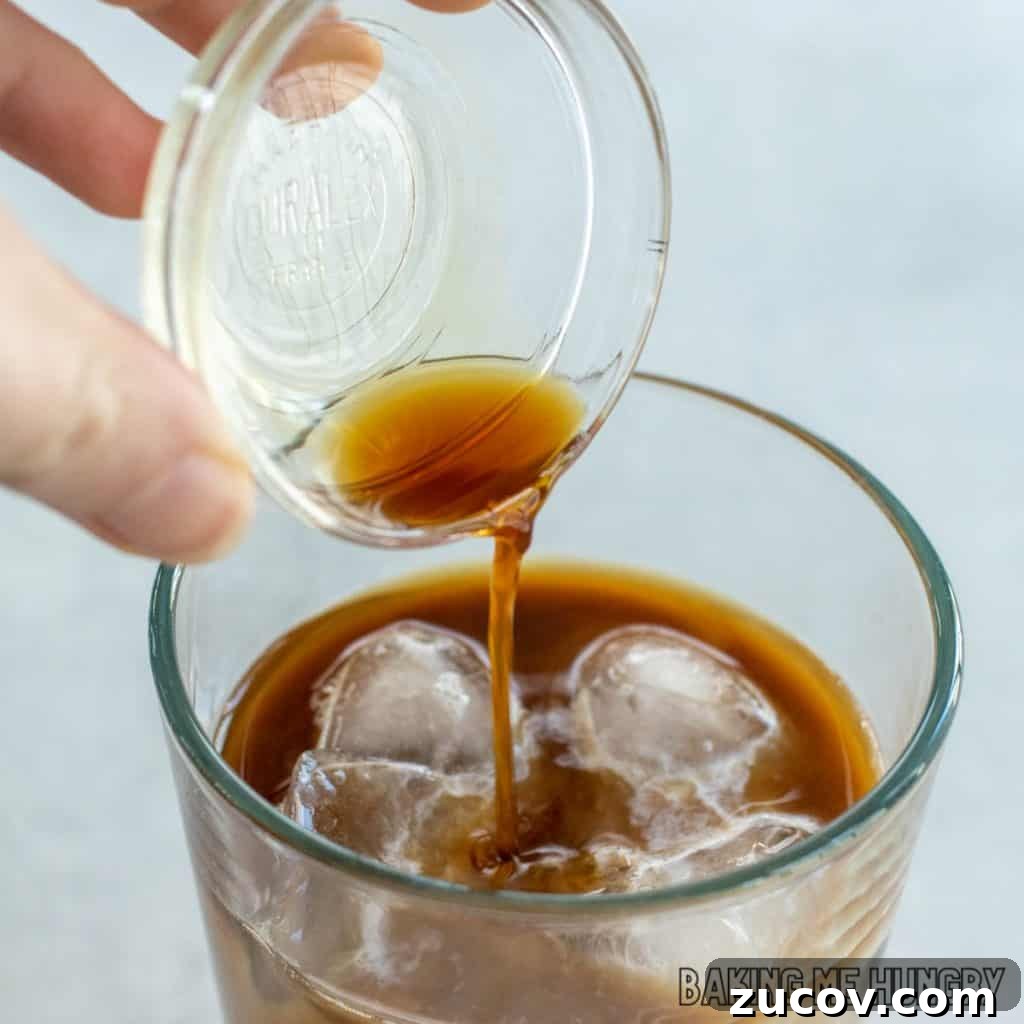 Creamy Vanilla Iced Coffee Recipe for Summer Refreshment 5 extract being poured into glass