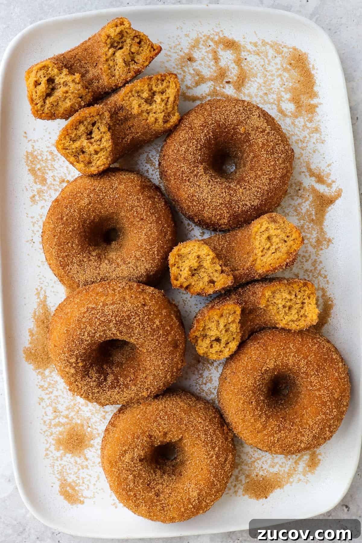 Gluten-Free Pumpkin Donuts Recipe That Actually Works 6 Donuts on a plate.