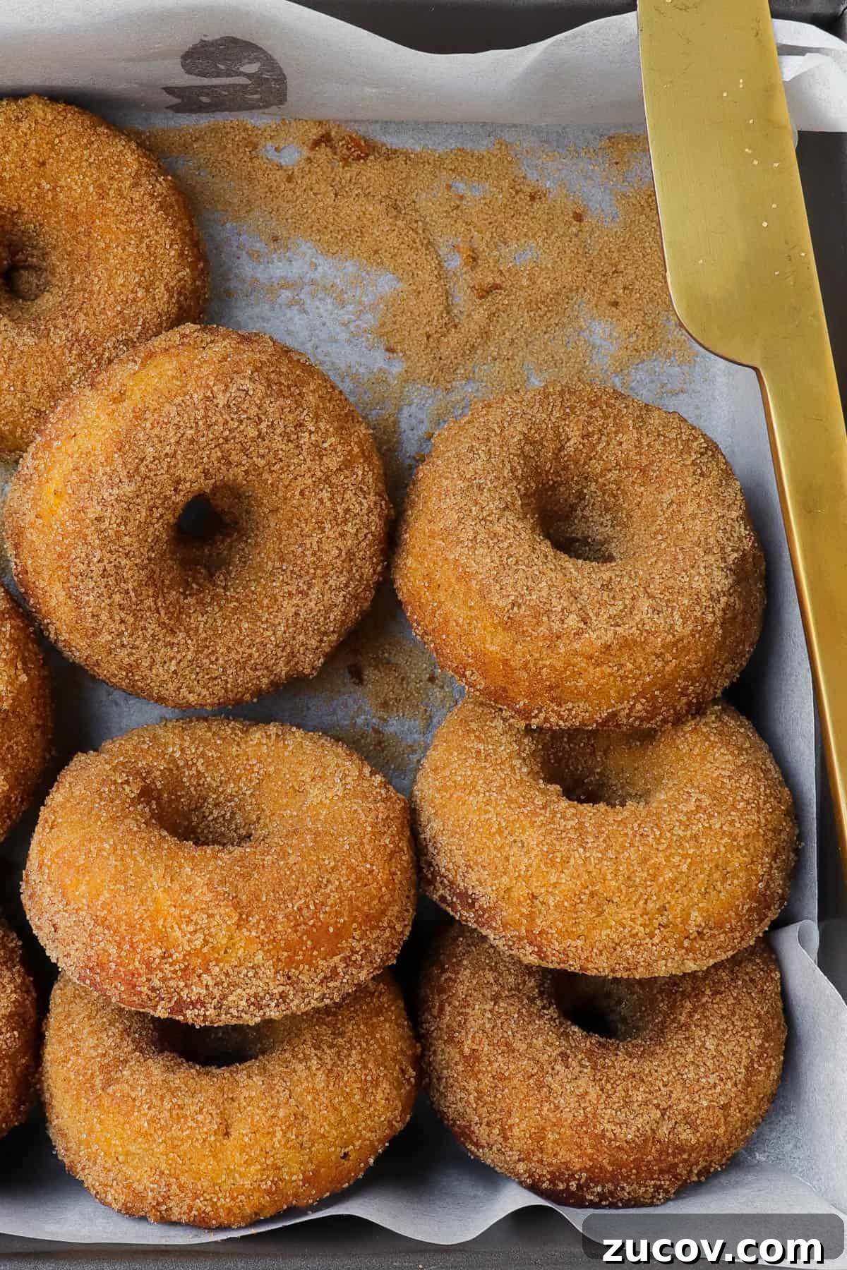 Gluten-Free Pumpkin Donuts Recipe That Actually Works 7 Closer up shot of the donuts with knife.