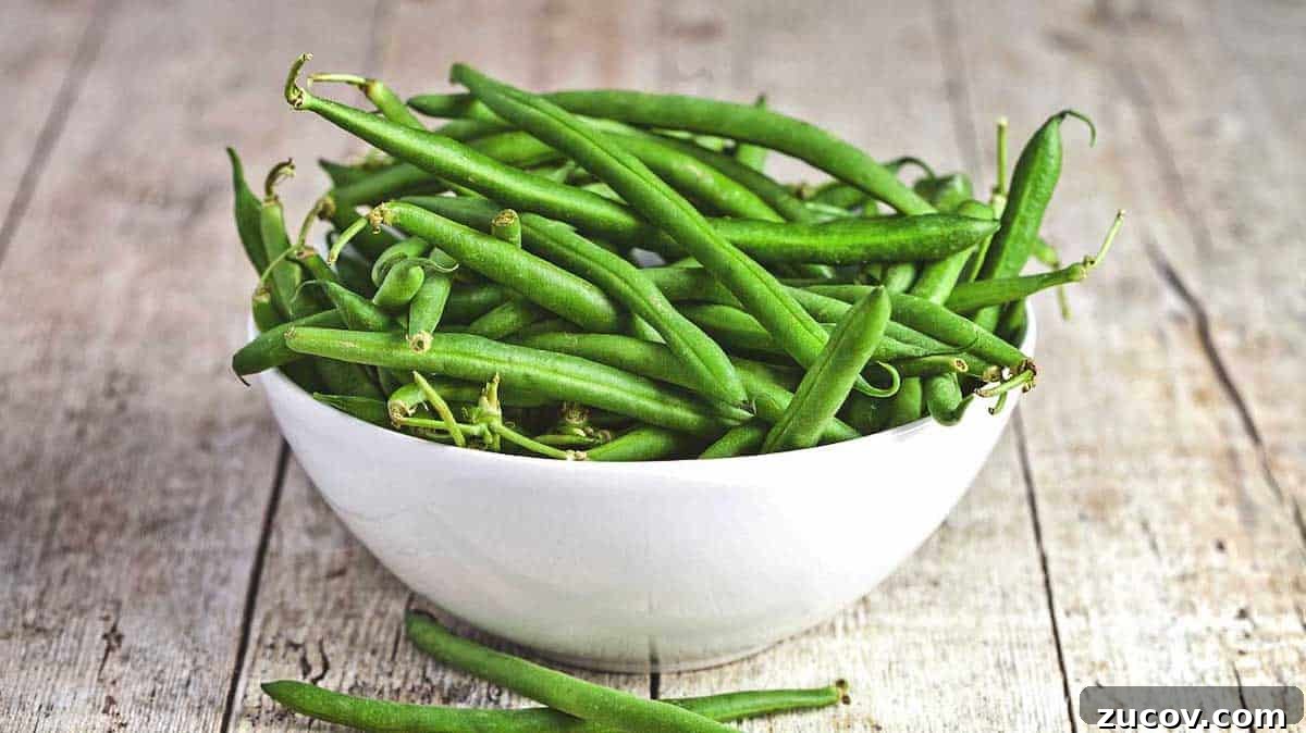 Crispy Asian-Style Garlic Green Beans Recipe 3 Green beans in a bowl on the table.