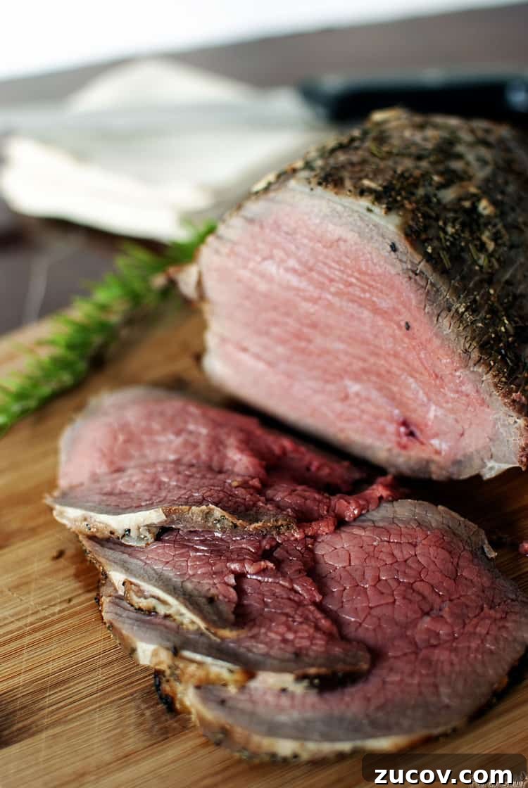Grilling a Perfect Roast: Tips for Juicy, Flavorful Results 3 grill-roasted beef on a wooden cutting board