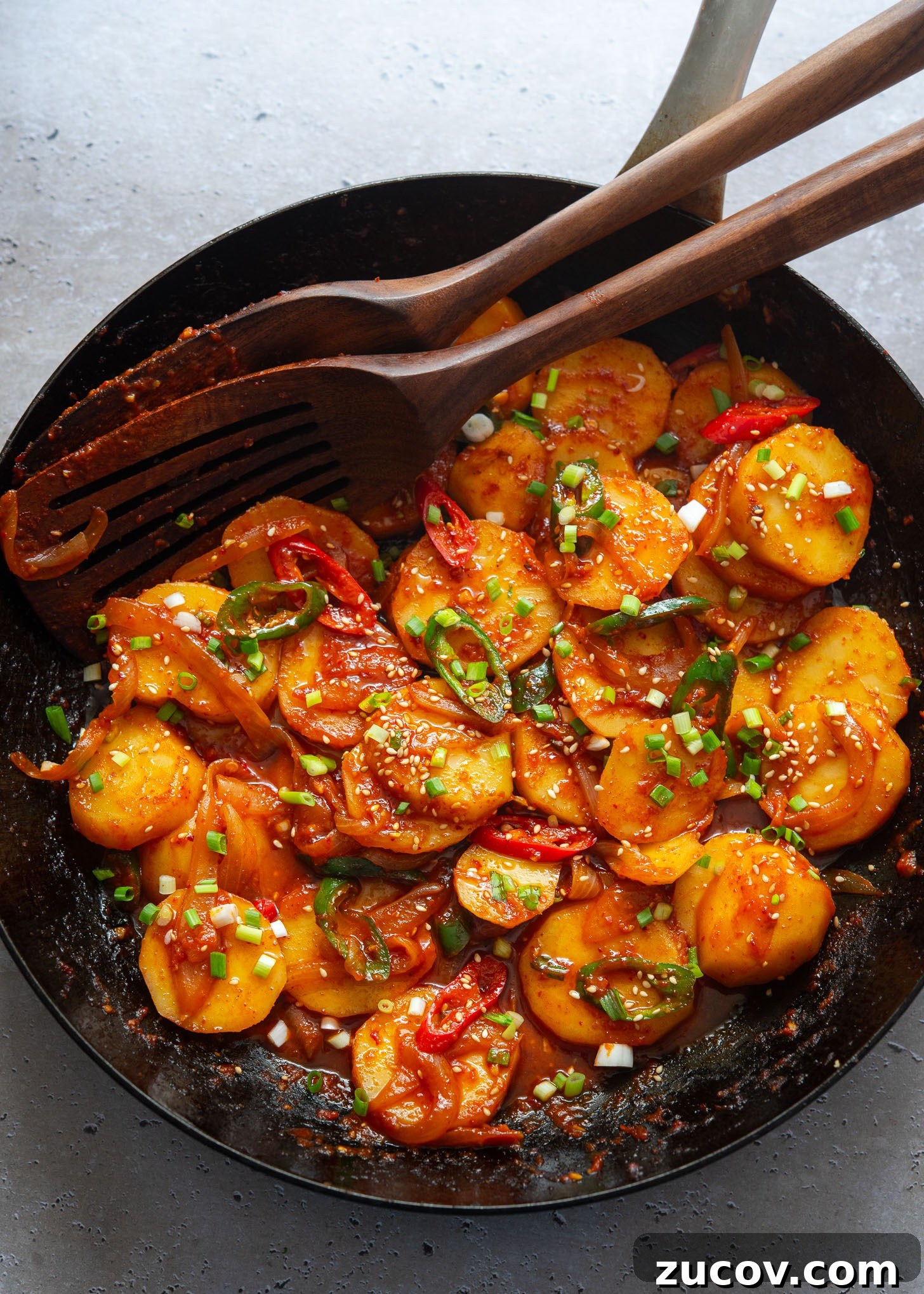Spicy Korean Braised Potatoes (Maeun Gamja Jorim) 2 Spicy potatoes braised in a skillet.