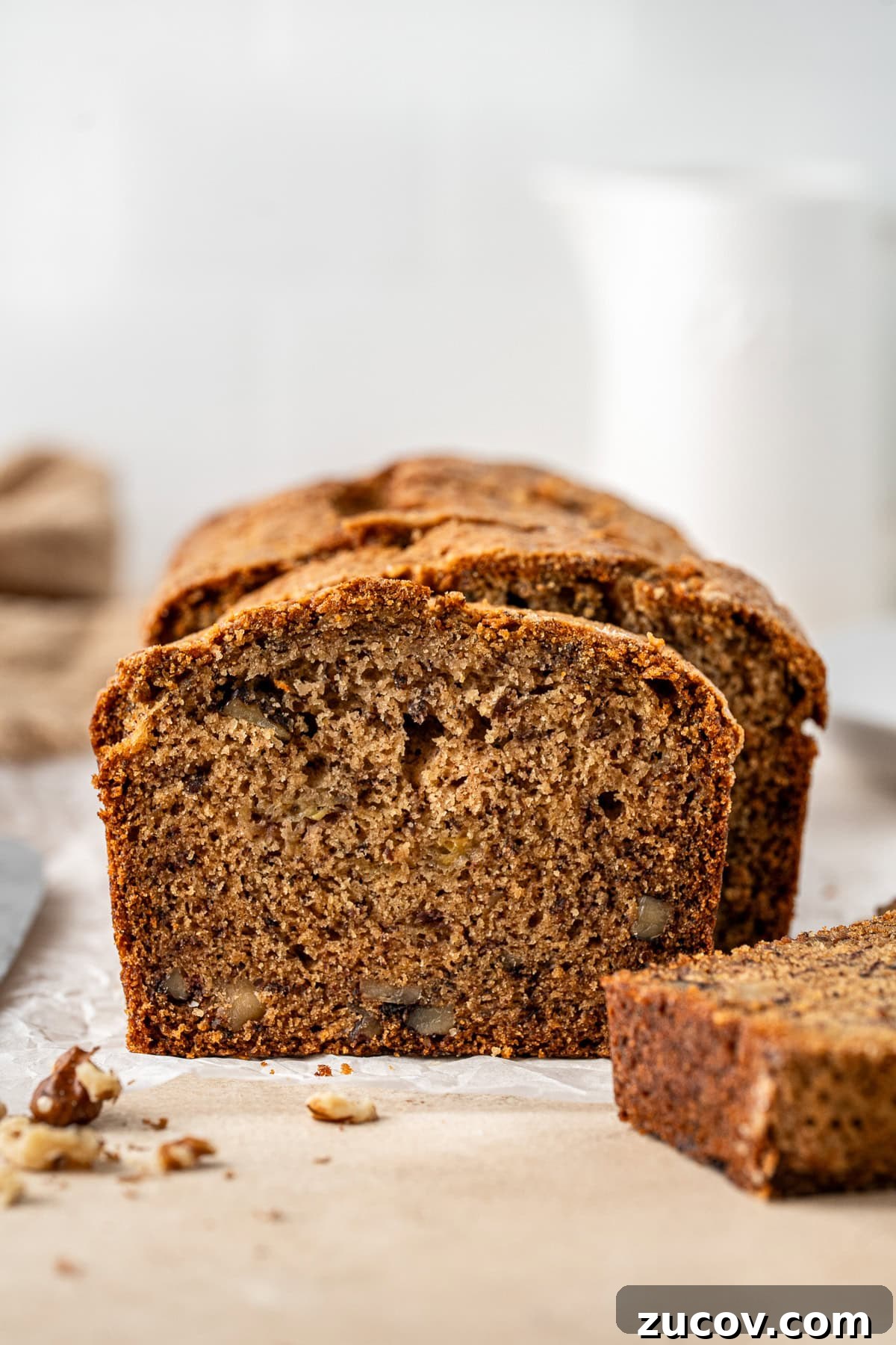 Ultimate Vegan Banana Bread Recipe You’ll Love 2 Close up of a loaf of dairy free banana bread sliced.