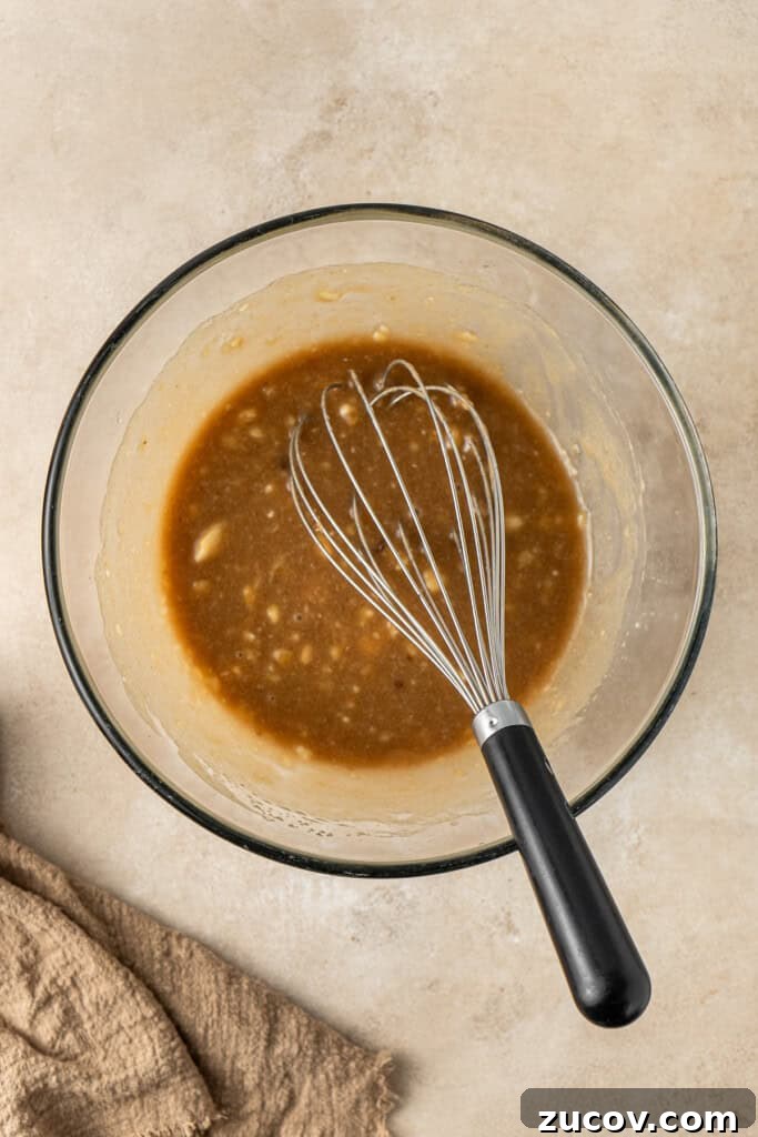 Ultimate Vegan Banana Bread Recipe You’ll Love 8 Whisking together the wet ingredients.