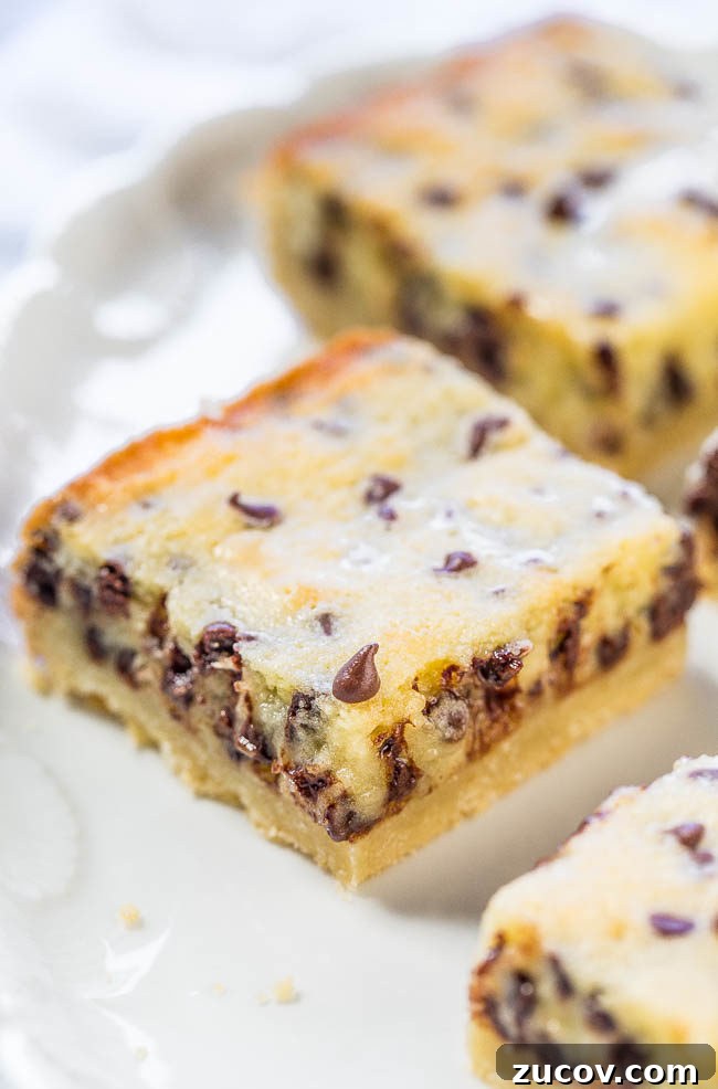 Gooey Chocolate Chip Butter Shortbread Bars 2 Gooey Butter Chocolate Chip Shortbread Bars - A buttery shortbread crust topped with a creamy, buttery topping that's almost like custard!! The bars live up to their gooey, buttery name!!