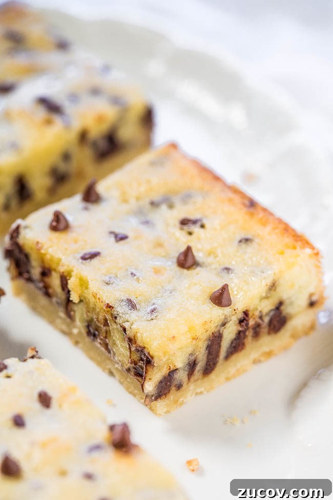 Gooey Chocolate Chip Butter Shortbread Bars 3 Gooey Butter Chocolate Chip Shortbread Bars - A buttery shortbread crust topped with a creamy, buttery topping that's almost like custard!! The bars live up to their gooey, buttery name!!