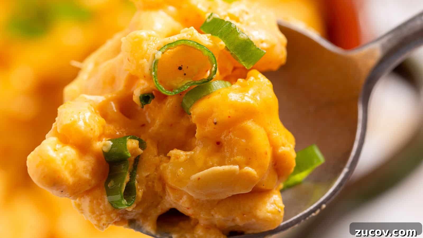 17 Comforting Side Dishes That Steal the Show 6 A bowl of macaroni and cheese in front of a slow cooker.