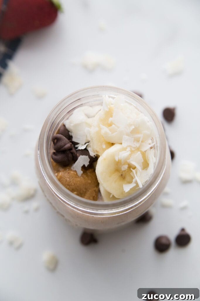 Creamy Overnight Oats: 5 Simple Recipes for Busy Mornings 7 Chunky Monkey Overnight Oats on a marble counter top with chocolate chips scattered around