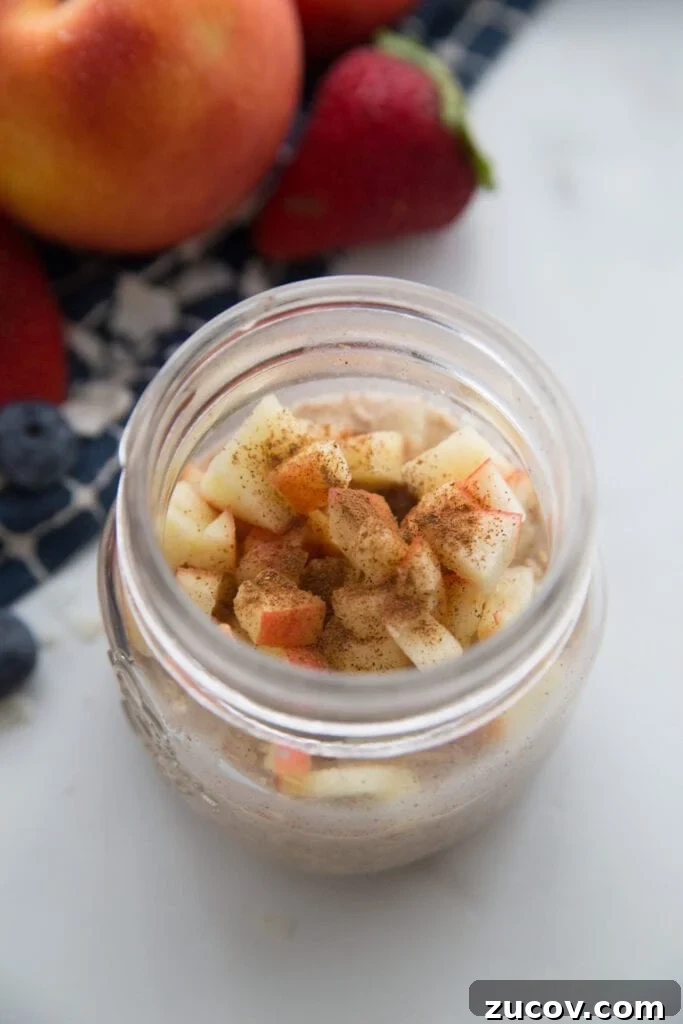 Creamy Overnight Oats: 5 Simple Recipes for Busy Mornings 10 A jar of apple cinnamon overnight oats topped with extra cinnamon