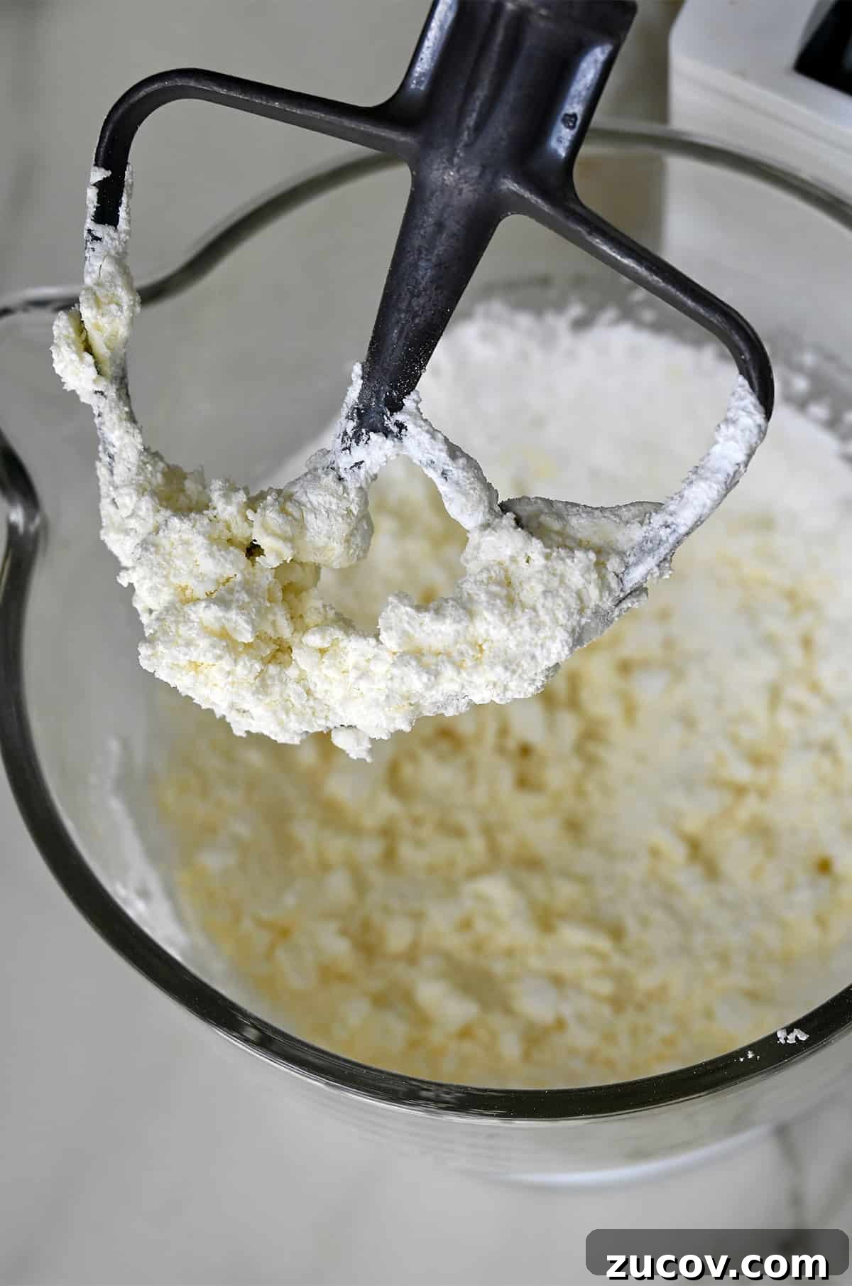 5-Minute Coffee Buttercream Frosting Recipe 6 Powdered sugar mixed with salt and butter in the bowl of a hand mixer with the paddle attachment.