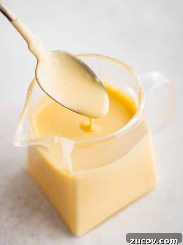 Creamy Homemade Tartar Sauce Recipe for Fish and Seafood 10 Small glass jar filled with homemade hollandaise sauce.