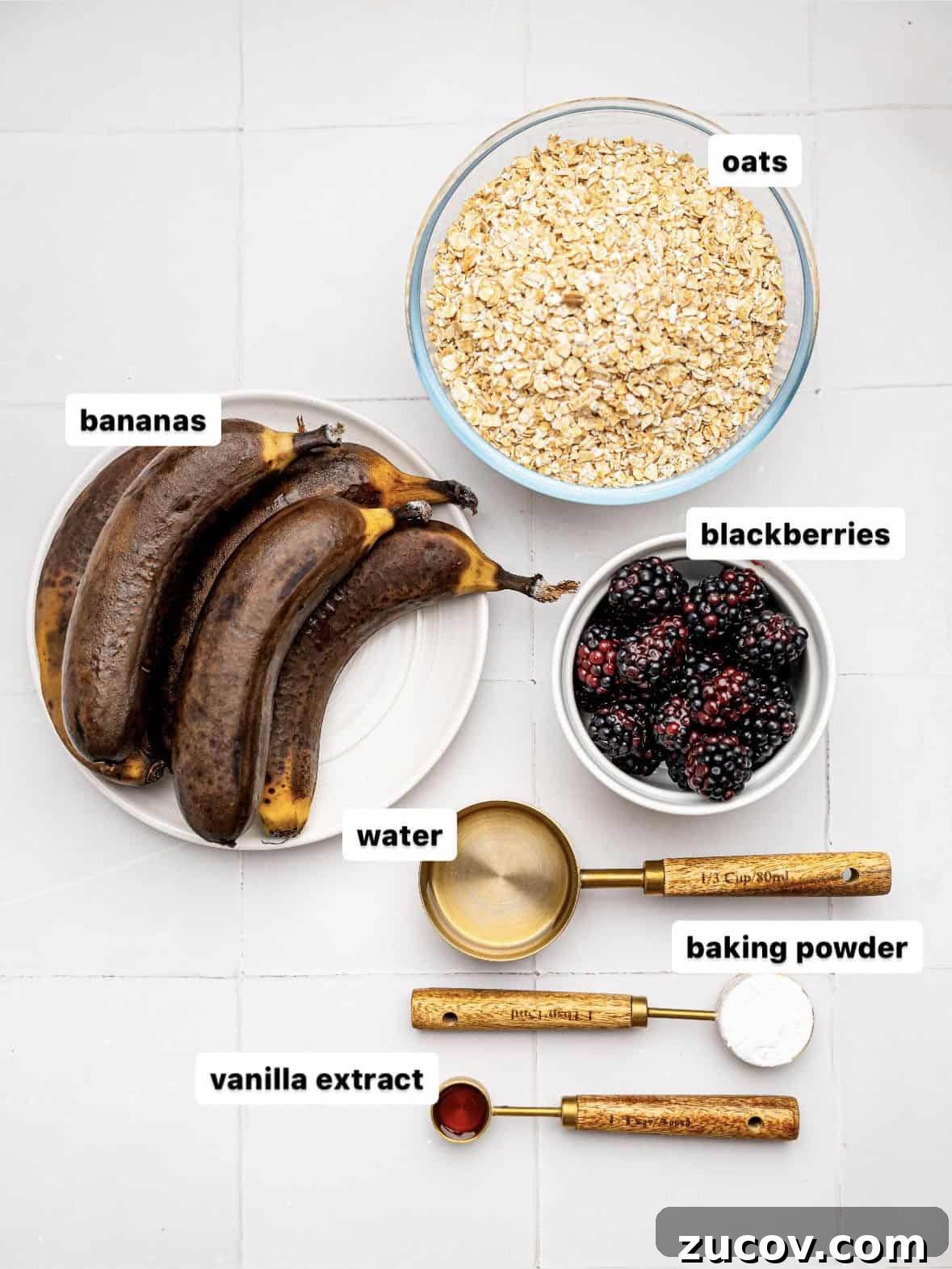 Banana Blackberry Muffins with 5 Simple Ingredients 6 Banana Blackberry Muffins ingredients on a white counter.