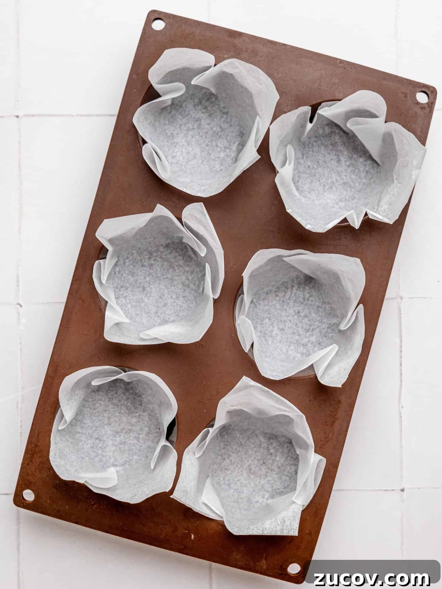Banana Blackberry Muffins with 5 Simple Ingredients 8 A silicone muffin tray with muffin liners made from parchment paper.