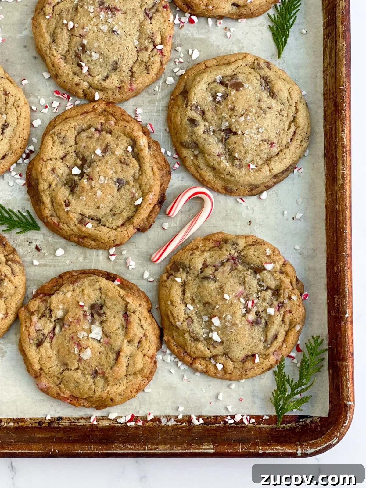 Peppermint Chocolate Chip Cookie Recipe with Crispy Edges 11 a few cookies on a cookie sheet.