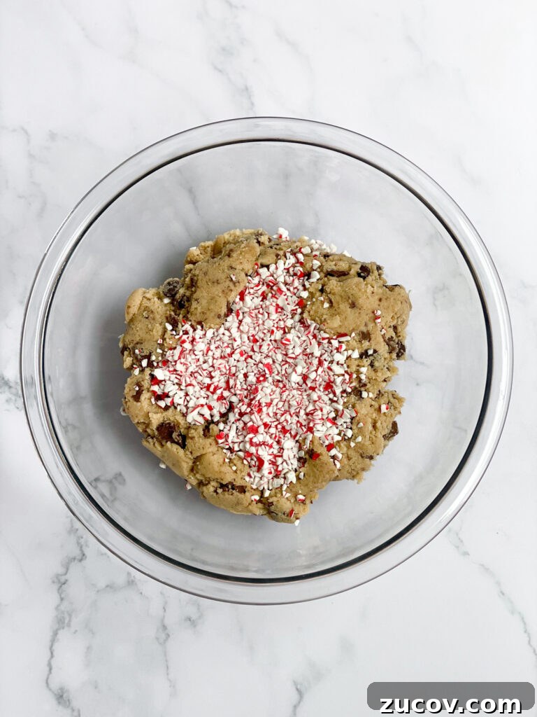 Peppermint Chocolate Chip Cookie Recipe with Crispy Edges 7 cookie dough with candy canes added.