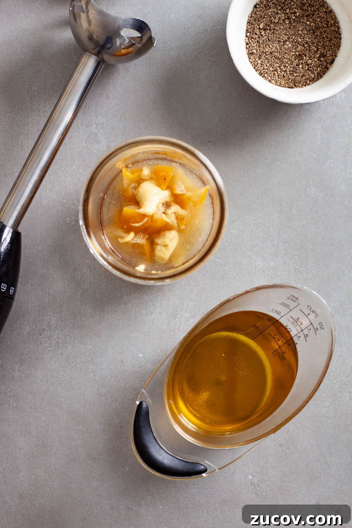 Preserved Lemon Vinaigrette Recipe for Bright, Tangy Salads 4 Chopped preserved lemons, dijon mustard, lemon juice and maple syrup in a glass mason jar.
