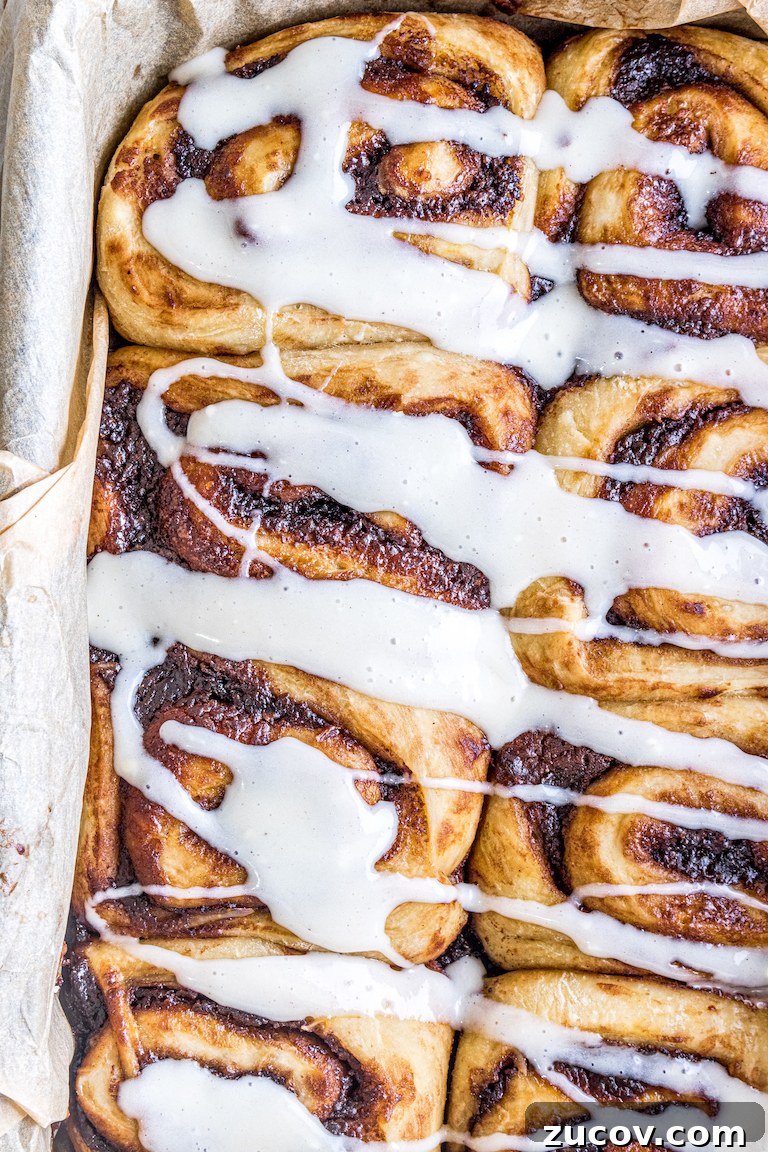 Nutella Pumpkin Cinnamon Rolls with Gooey Chocolate Swirl 4 close up view of the finished nutella pumpkin cinnamon rolls