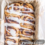 Nutella Pumpkin Cinnamon Rolls with Gooey Chocolate Swirl 8 top down view of baking pan filled with the finished nutella pumpkin cinnamon rolls