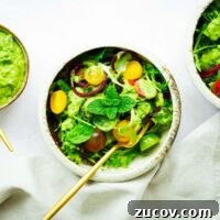 Creamy Avocado Green Goddess Dressing Recipe for Salads and Bowls 9 Vegan avocado green goddess dressing drizzled over a tomato and herb salad.