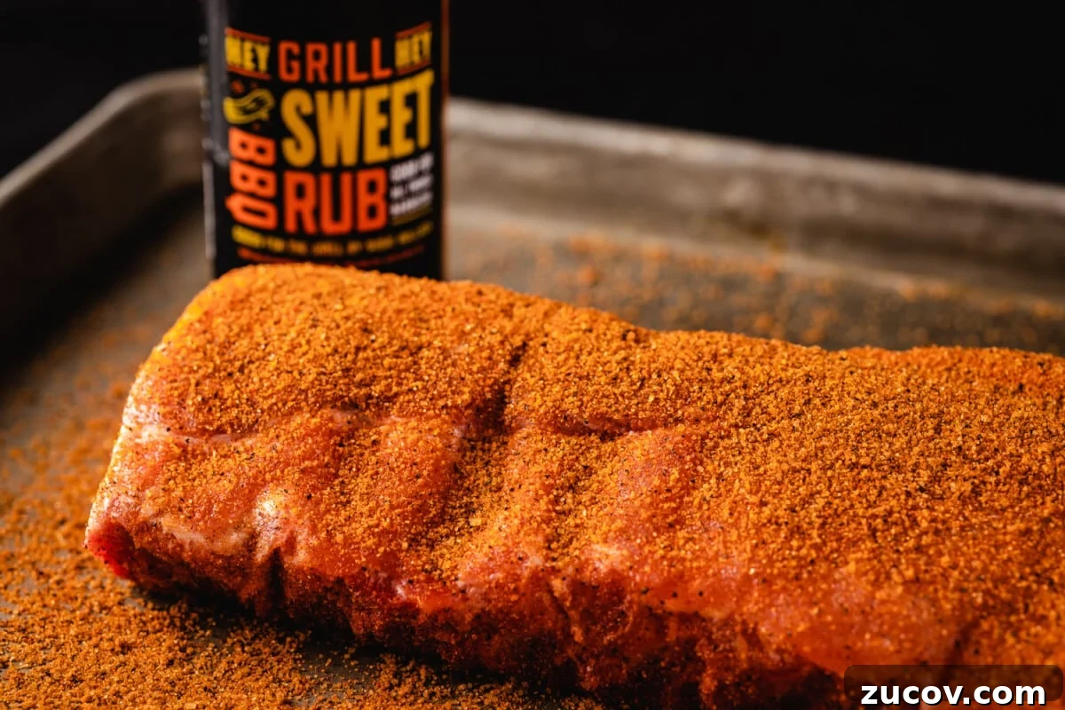 Sweet Rub Recipes to Elevate Your Dinner Menu 6 Seasoned ribs next to a bottle of Hey Grill Hey Sweet Rub.