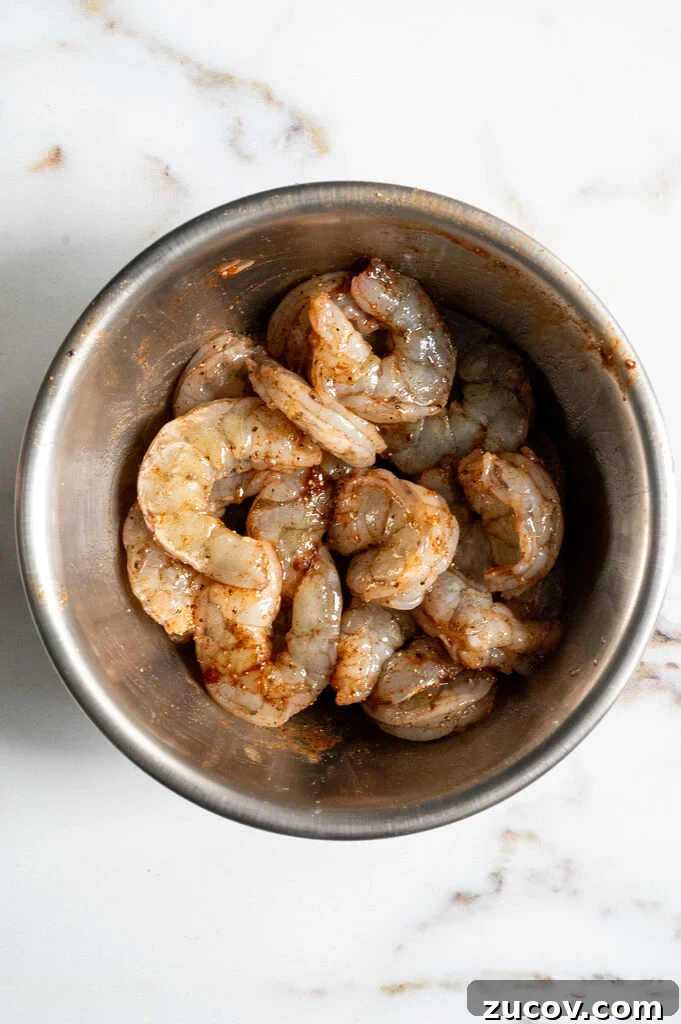 Garides Youvetsi: Greek Shrimp with Orzo Recipe 8 seasoned shrimp in a stainless steel bowl.