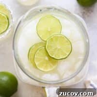 Canned Margaritas: 8 Refreshing Ready-to-Drink Cocktail Ideas 6 An above view of a pitcher of tin can margaritas with extra limes