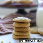 cookies stacked in front of milk and cake stand