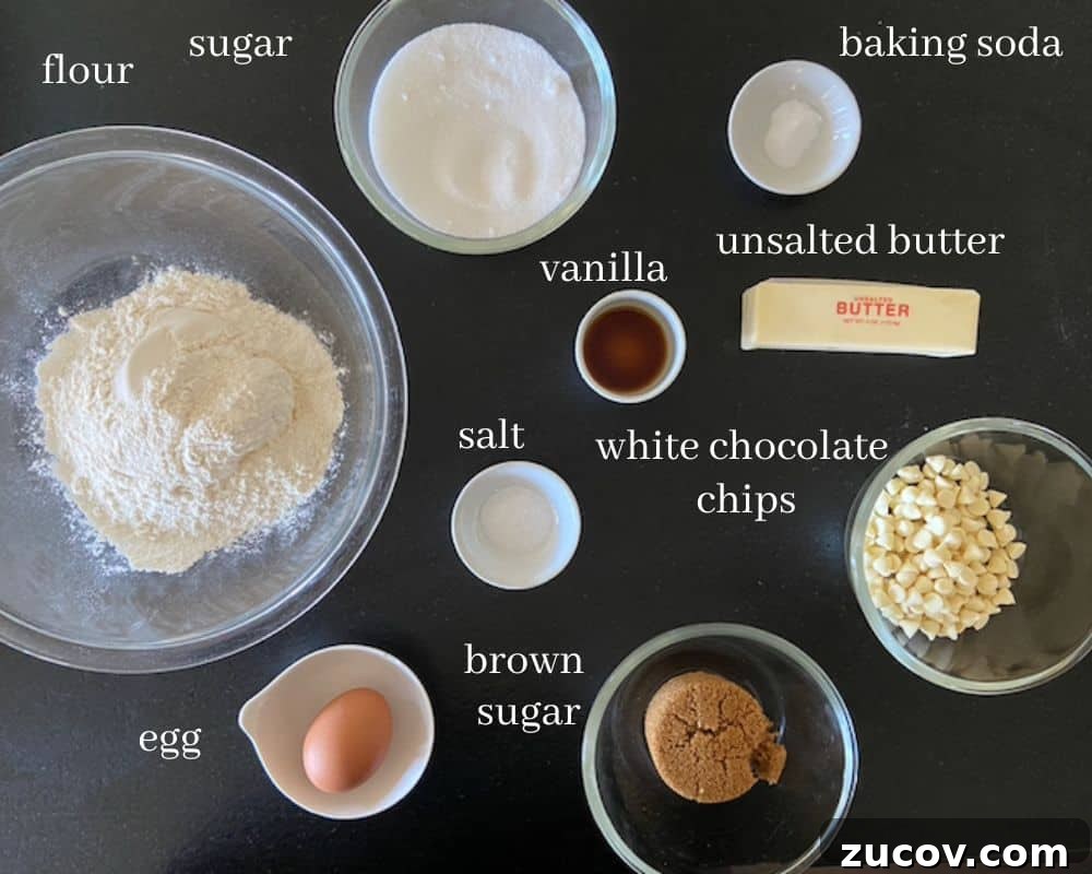 Chewy White Chocolate Chip Cookie Recipe for Perfect Bakes 3 white chocolate cookie ingredients with text on black countertop
