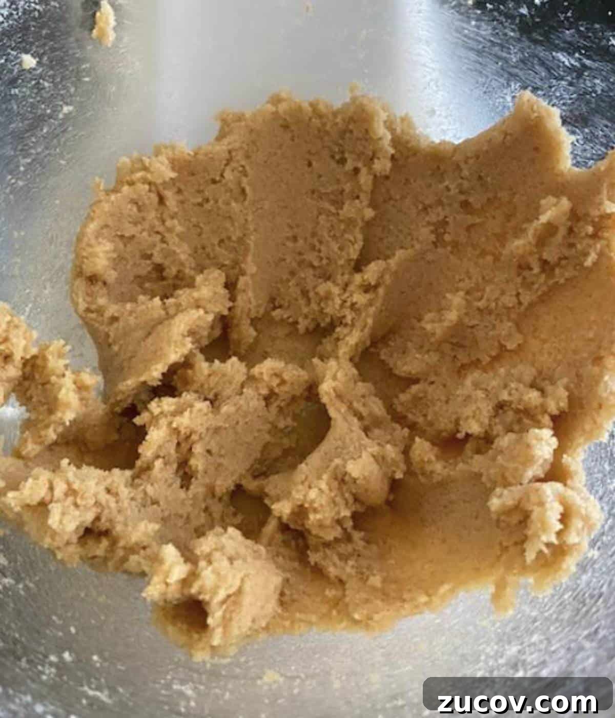 Chewy White Chocolate Chip Cookie Recipe for Perfect Bakes 5 Wet ingredients for cookies in stand mixer bowl.