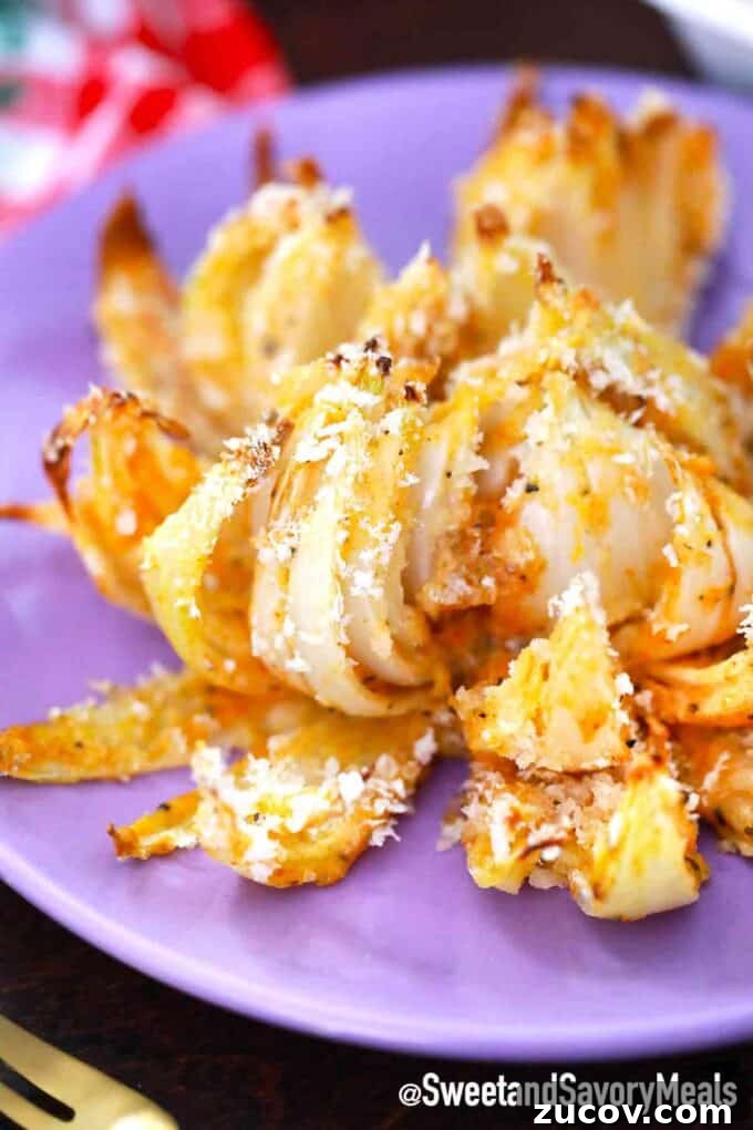 Crispy Blooming Onion Recipe Made in the Air Fryer 2 Crispy blooming onion on a plate with panko breadcrumbs