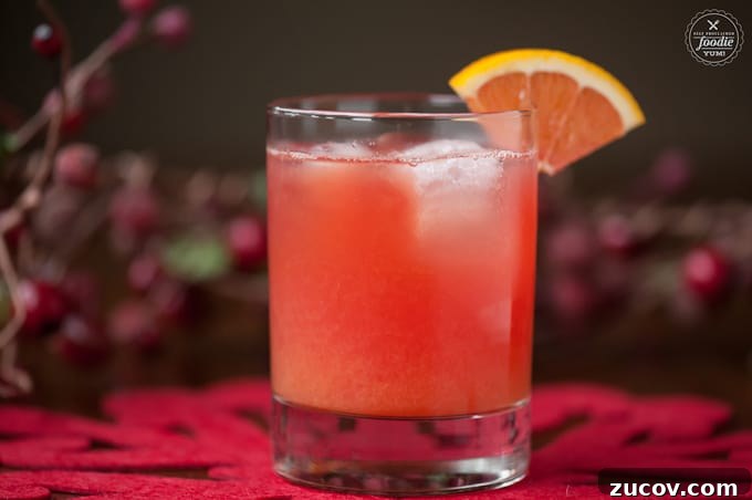 Cranberry Screwdriver on a festive table Cranberry Screwdriver with cranberry vodka, freshly squeezed orange juice, and a splash of Grand Marnier on a festive table