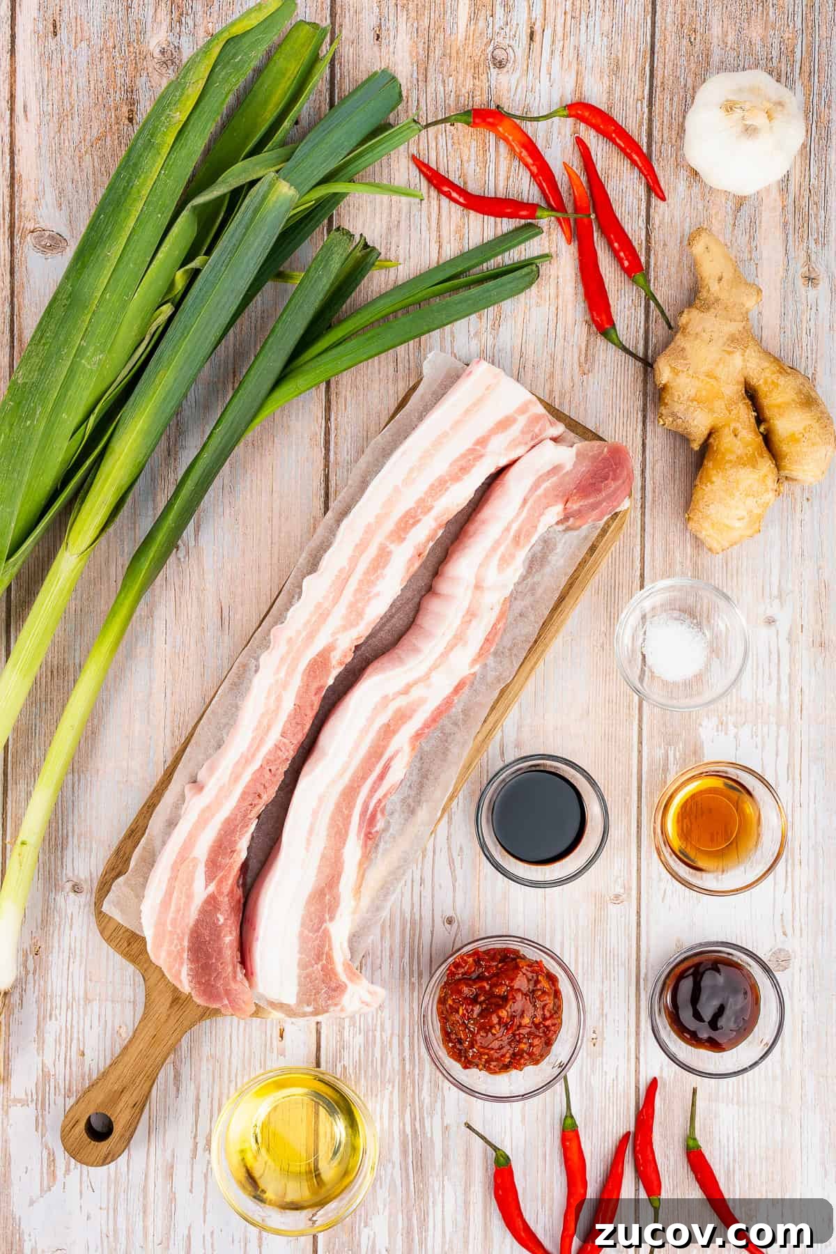 If you love bold flavors and quick dinners, Twice Cooked Pork might become your new best friend.

In China’s Sichuan Province, this dish is as famous as mapo tofu or red‑braised pork.

The Chinese name is hui guo rou, which means “returned‑to‑the‑wok pork.”

That’s because the pork belly really is Twice Cooked Pork, here: first it’s gently boiled, and then it’s hit with high heat in a sizzling stir fry!