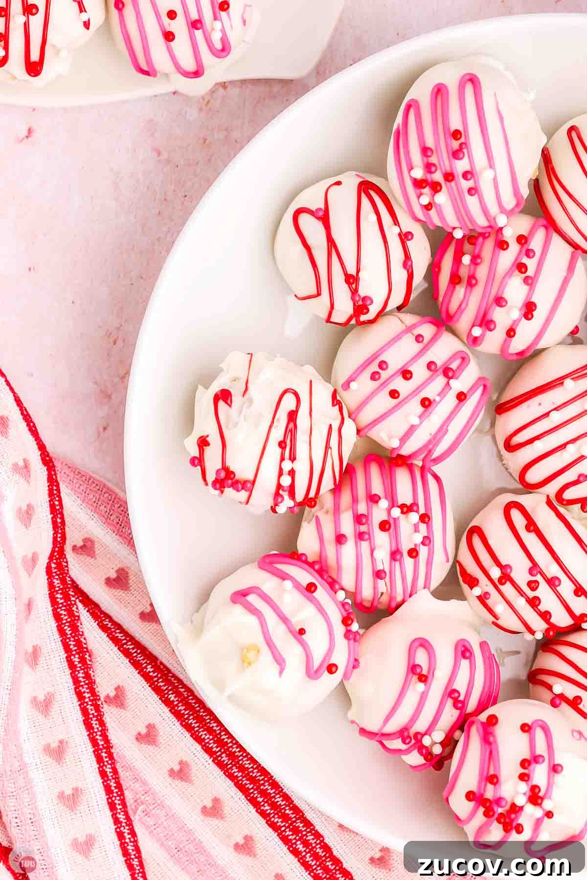 Valentine's Day Treat Box Ideas for Gifts and Party Favors 9 close up of Oreo balls with pink and white icing