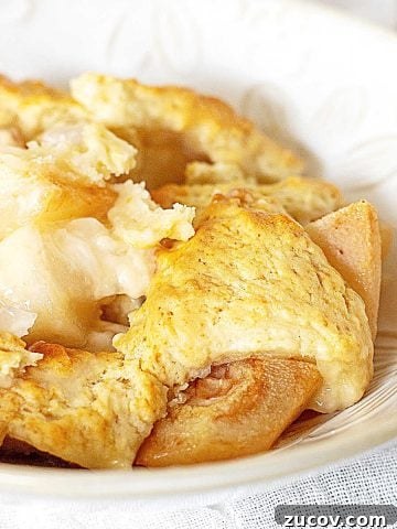 Serving of pear cobbler in a white bowl.