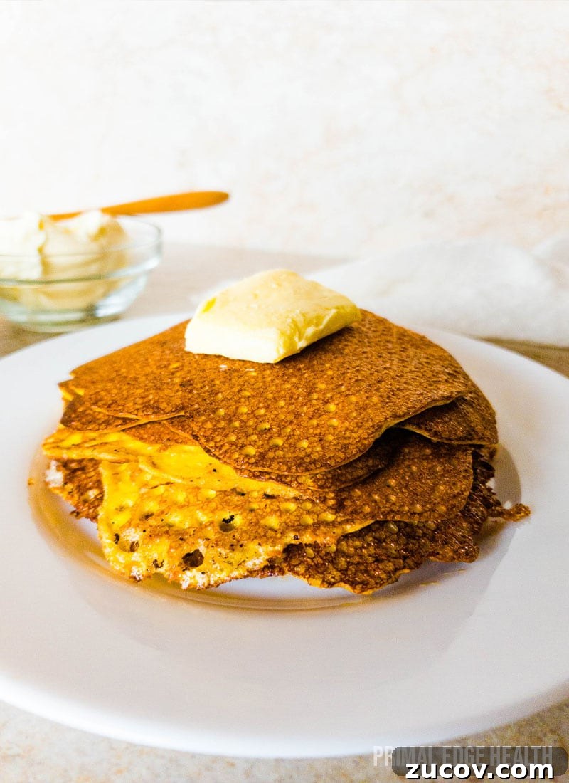 28 Low-Histamine Recipes for Histamine Intolerance-Friendly Meals 5 A stack of pancakes with a pat of butter on top on a plate.